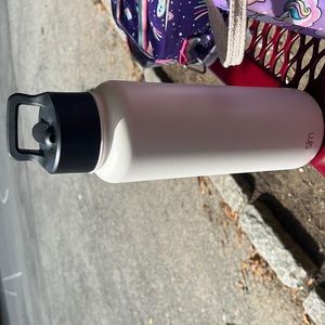 Simple modern water bottle in the color white with a straw lid. It's great!